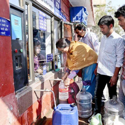 Local people avail the facility of Sulabh Water ATM installed at Sulabh campus, New Delhi