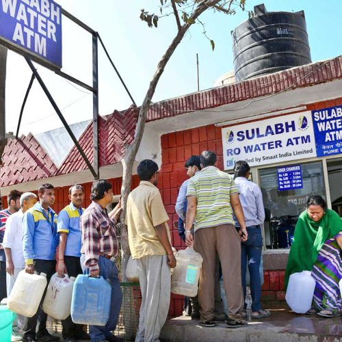 Local people standing in queue waiting for their number to get Sulabh Drinking Water from ATM in New Delhi