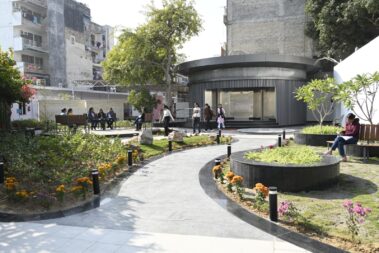 Garden area and curved walkway in front of the modern Sulabh Aspirational Toilet at the Delhi campus.