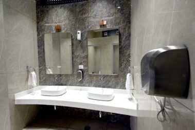 Interior view of the Sulabh Aspirational Toilet showing the baby care station and clean hygiene setup.
