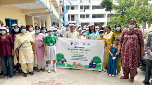 Sulabh International and IIHH team with teachers and community members holding the Swachhata Hi Seva 2026 banner