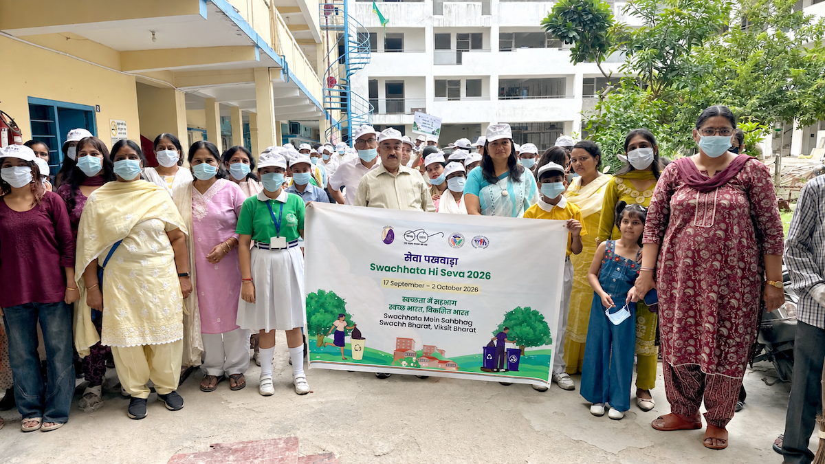sulabh-iihh-team-community-members-swachhata-hi-seva-2026-group-photo Sulabh International and IIHH team with teachers and community members holding the Swachhata Hi Seva 2026 banner